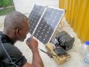 Dominican ham Joseph Raymond, J73RJ, testing donated equipment in the immediate aftermath of Hurricane Maria. [Brian Machesney, K1LI/J7Y, photo]